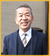 取締役会長：荻野　典光